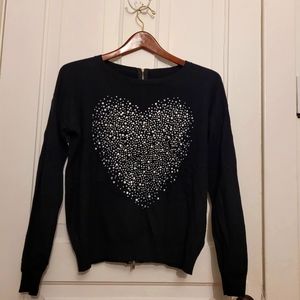 Black Sweater with sparkly heart. Zipper up the back.  Size M.